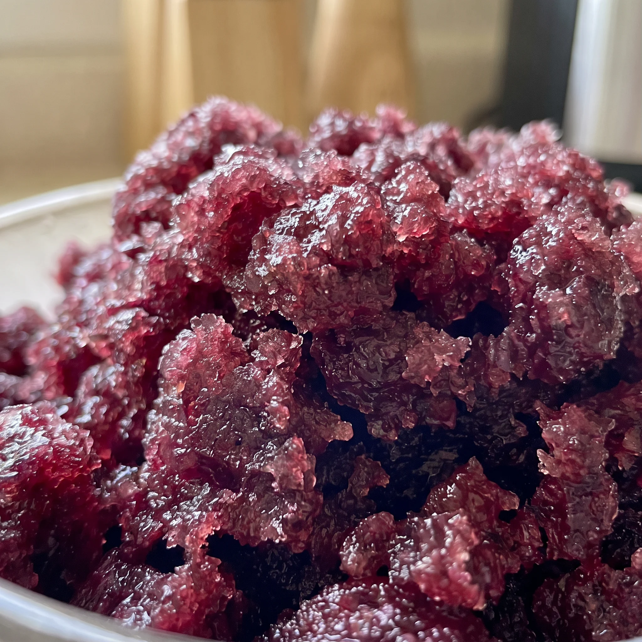 Glossy dark cherry chunks embedded in icy red granita, with a hint of almond extract.