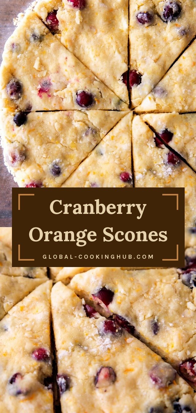 Golden triangular scones flecked with red cranberries, drizzled with orange glaze and topped with orange zest.